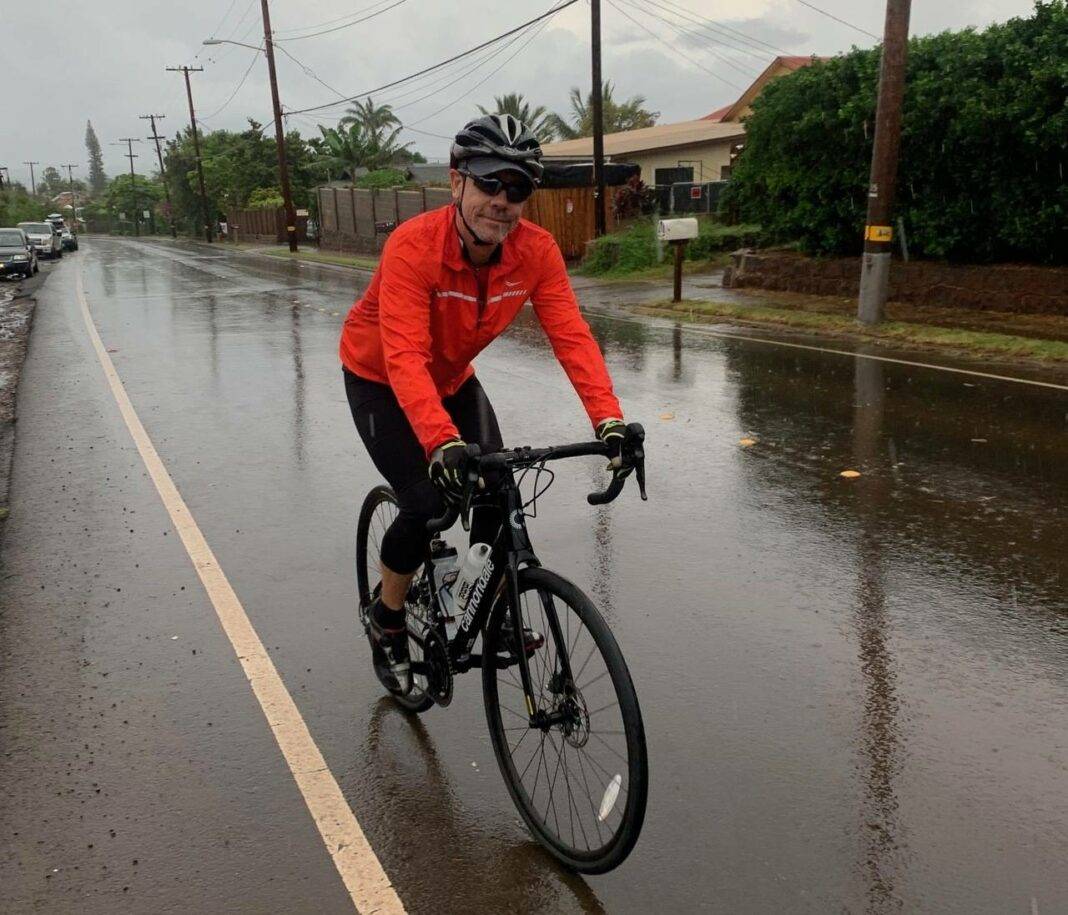 Jim Miller biking in the rain