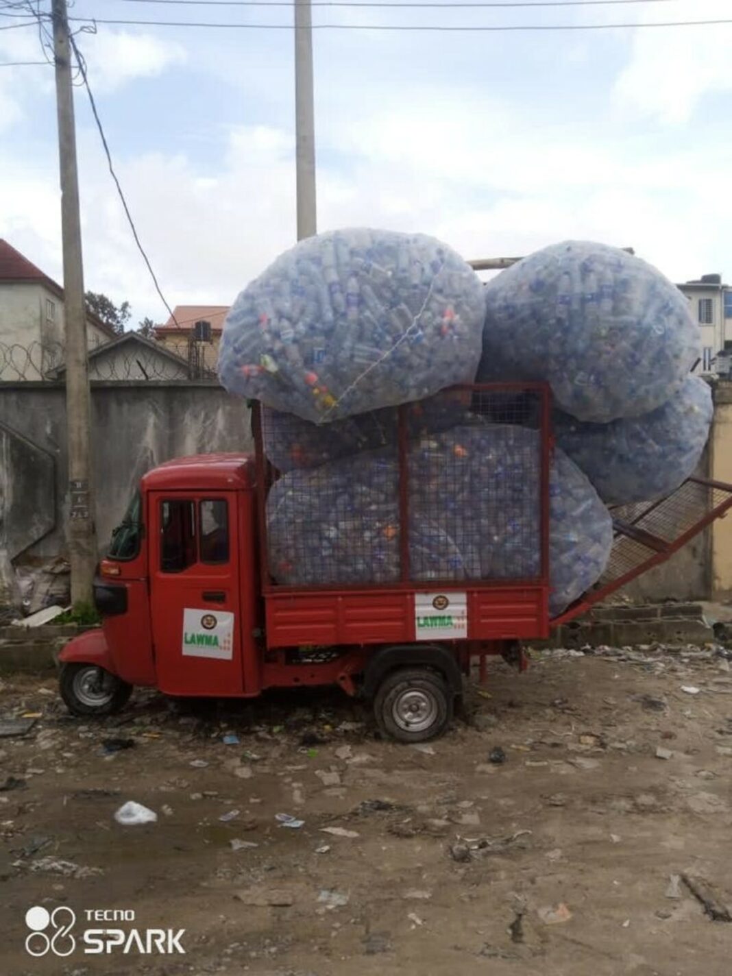 red truck carrying trash